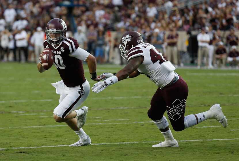 Texas A&M quarterback Kyle Allen (10) scrambles out of he pocket as Mississippi State...