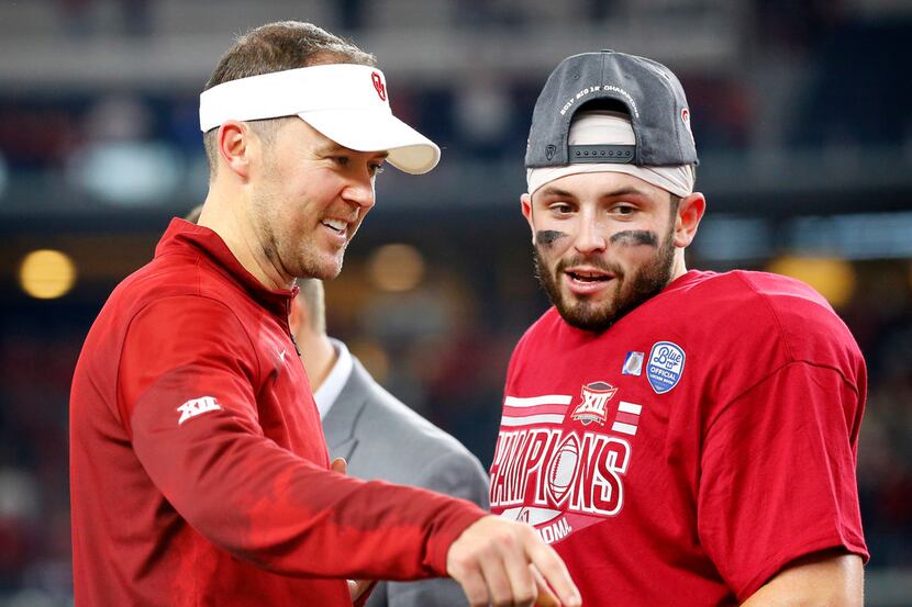 Oklahoma Sooners head coach Lincoln Riley and quarterback Baker Mayfield (6) celebrate their...