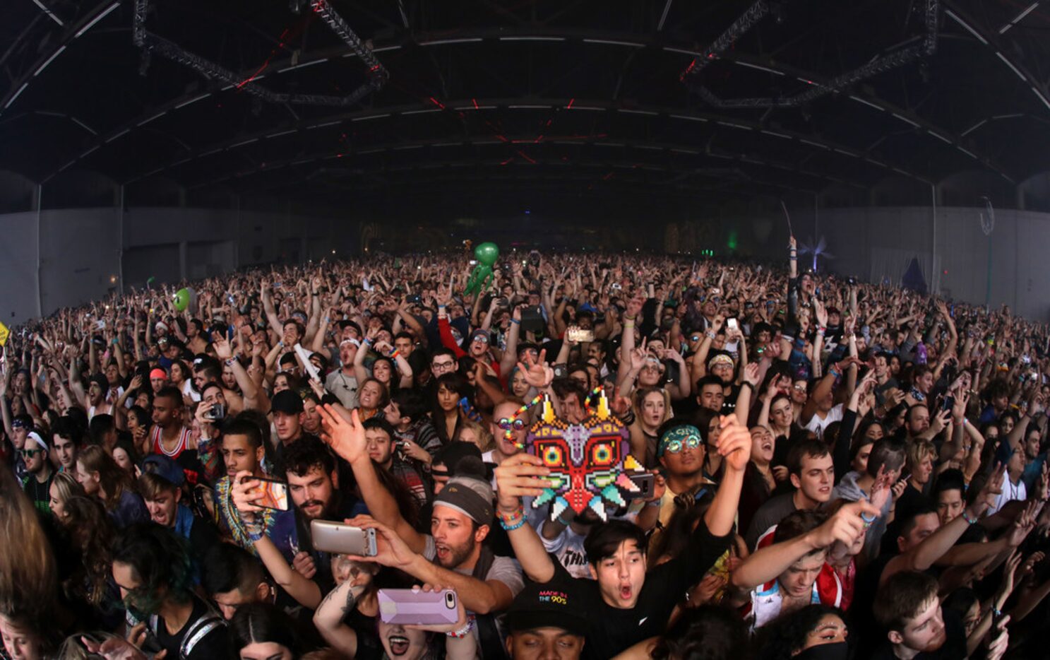 Guests enjoy the music during the Lights All Night music festival at Dallas Market Hall in...