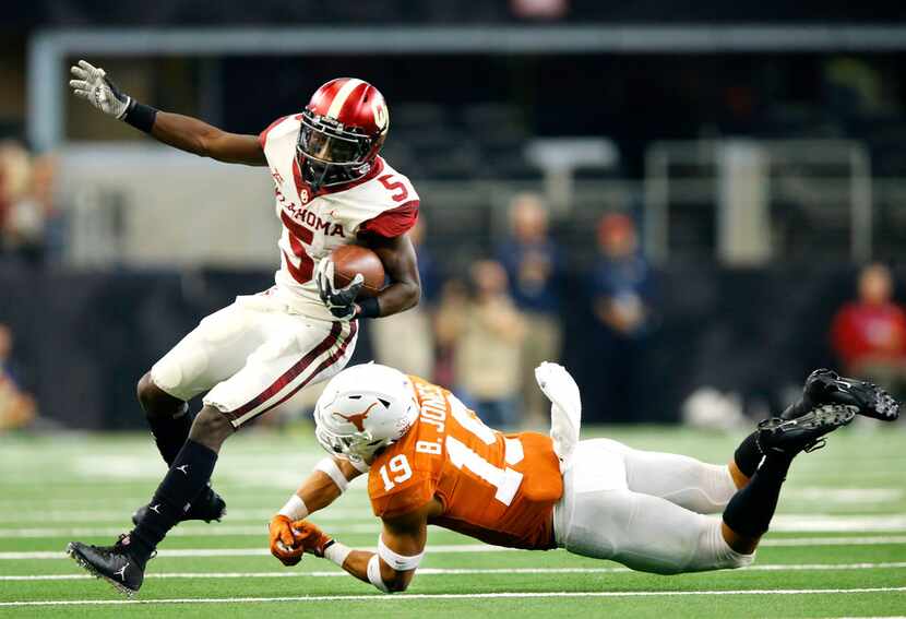 FILE - Texas Longhorns defensive back Brandon Jones (19) whiffs on a tackle attempt of...