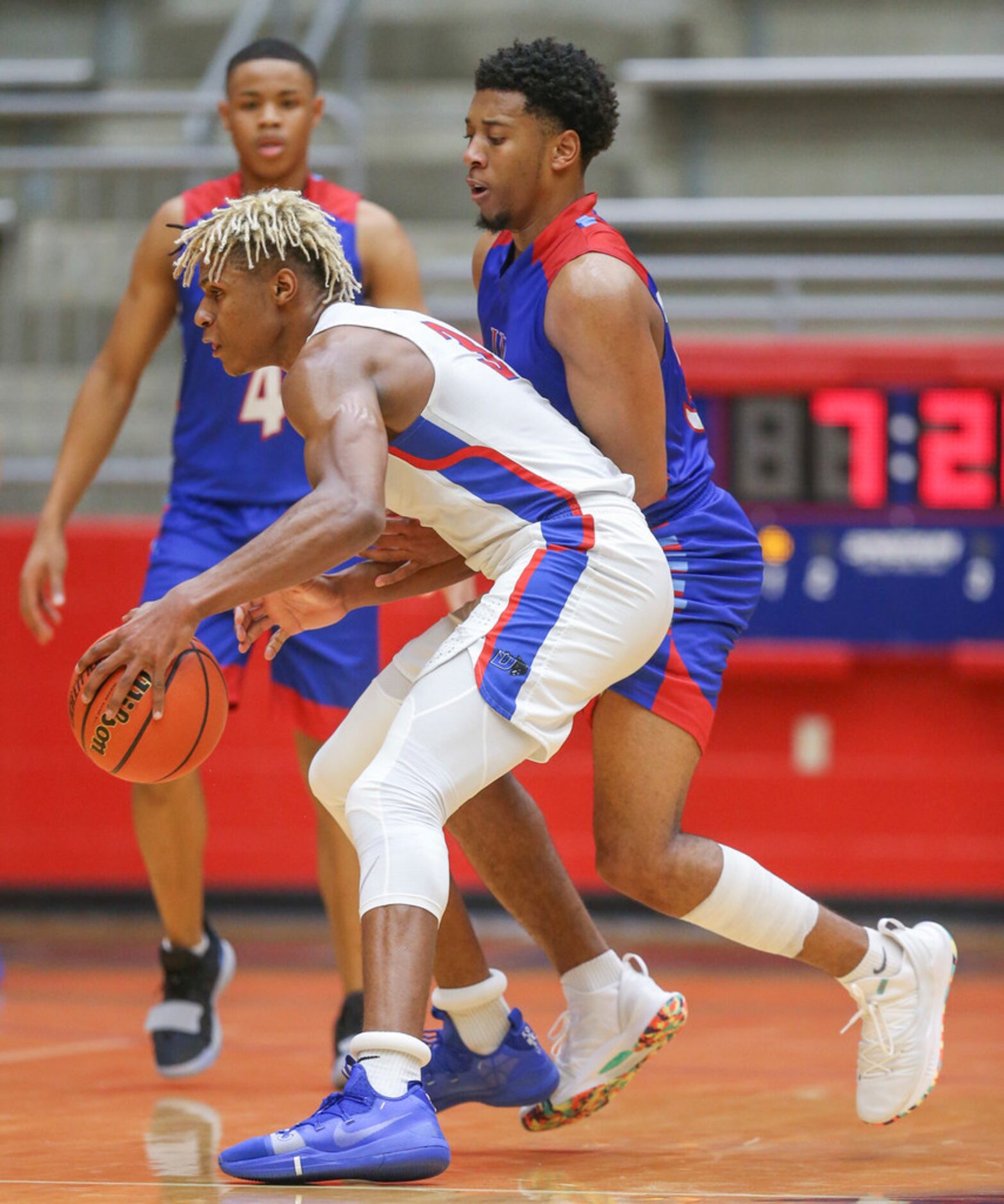 Duncanville guard Jahmius Ramsey (3) drives the ball past J. J. Pearce guard Braeson...