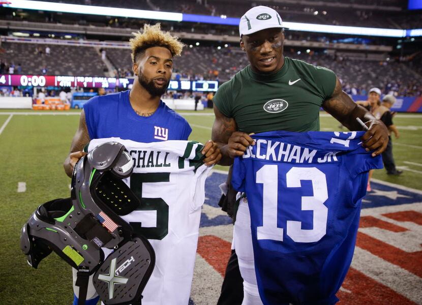FILE - In this Aug. 29, 2015, file photo, New York Giants wide receiver Odell Beckham, left,...
