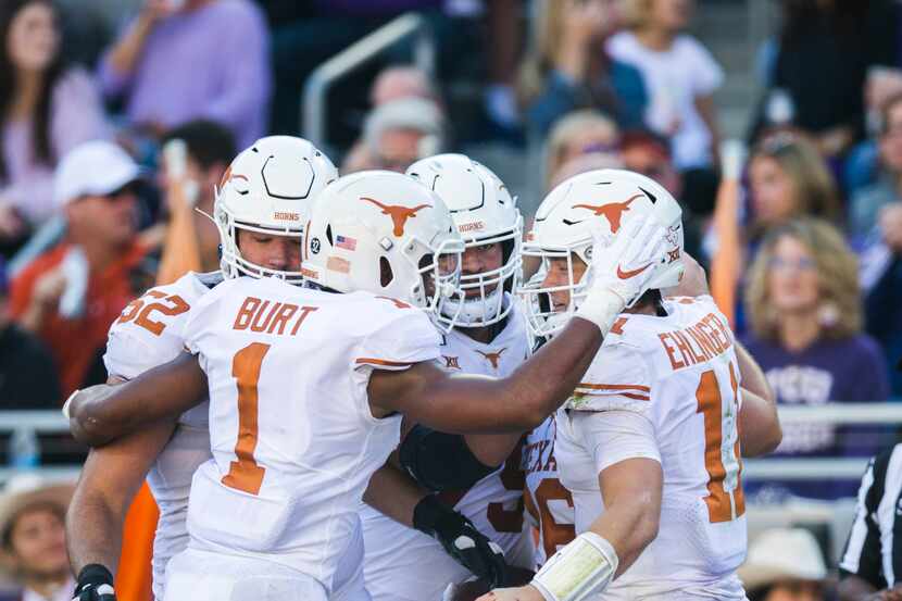 Texas Longhorns celebrate a touchdown during the second quarter of an NCAA football game...