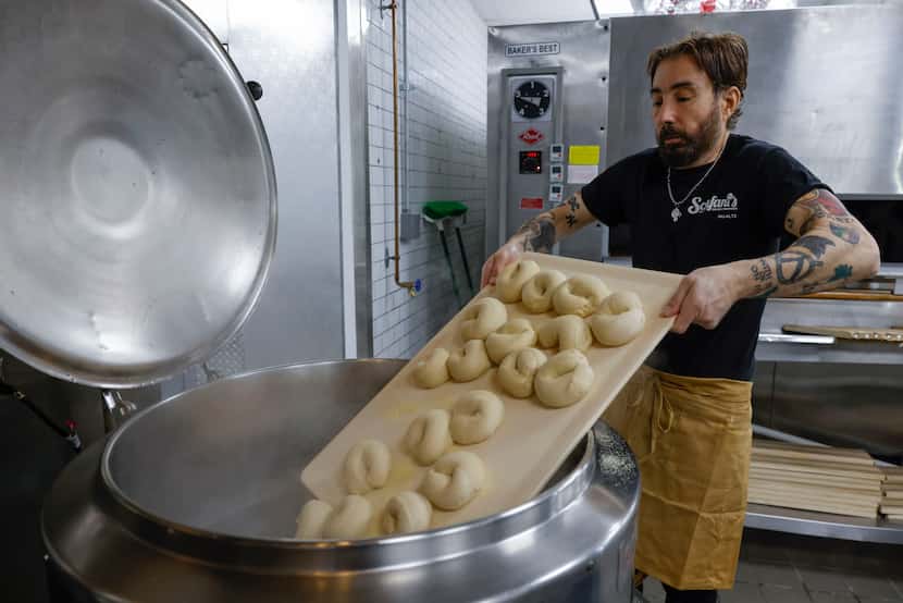 Chris Sclafani, owner of Sclafani’s New York Bagels and Sandwiches, puts bagel domes in a...