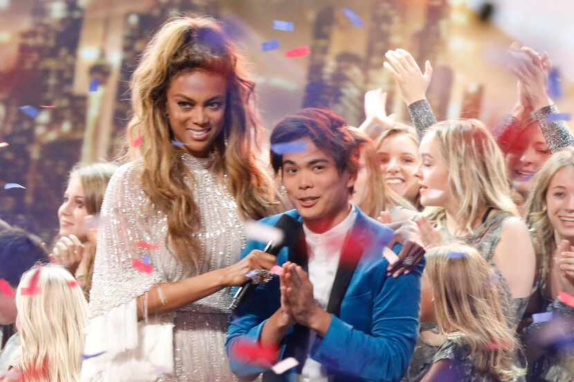 Host Tyra Banks, left, stands with Shin Lim, winner of this season's "America's Got Talent."...