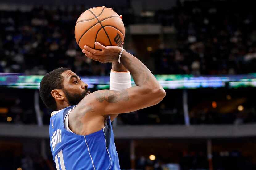 Dallas Mavericks guard Kyrie Irving (11) takes a first half shot against the New Orleans...