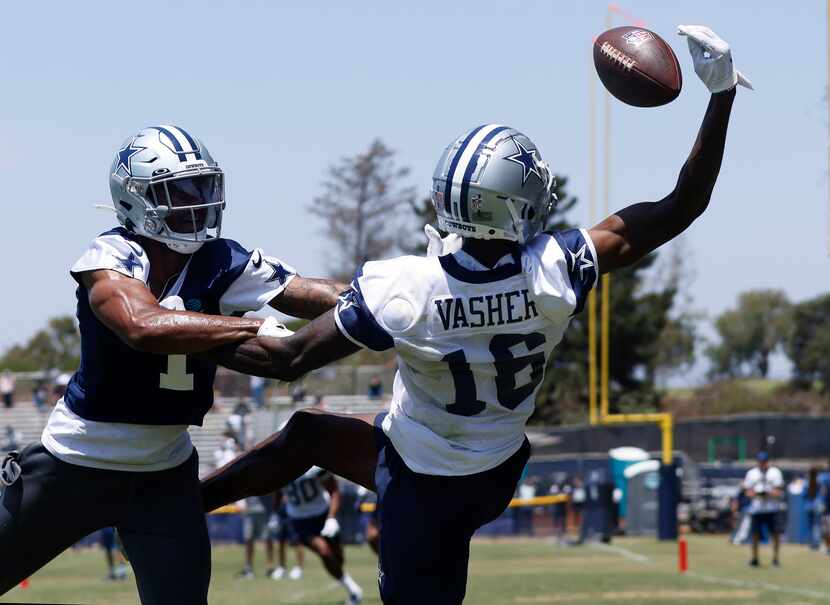 Dallas Cowboys wide receiver T.J. Vasher (16) makes a one-handed grab as he’s covered by...