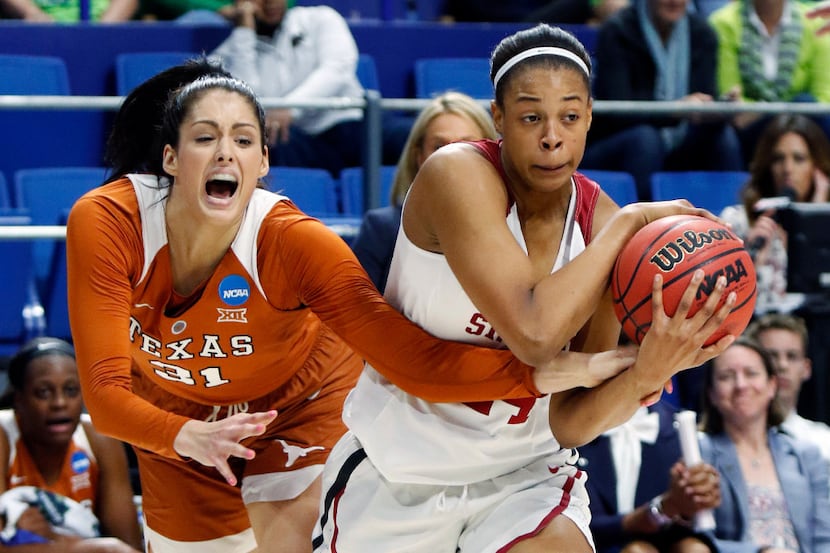 Stanford's Erica McCall, right, is pressured by Texas' Audrey-Ann Caron-Goudreau during a...