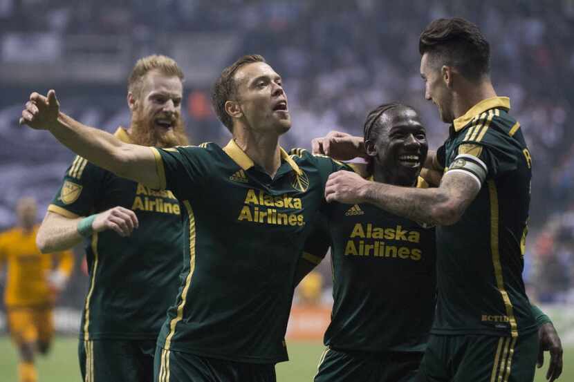 Portland Timbers FC Diego Chara (second from right) celebrates his goal against the...