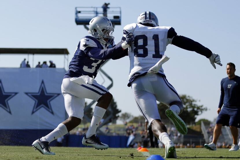 Dallas Cowboys defensive back Jeremiah McKinnon (37) pushes on Dallas Cowboys wide receiver...
