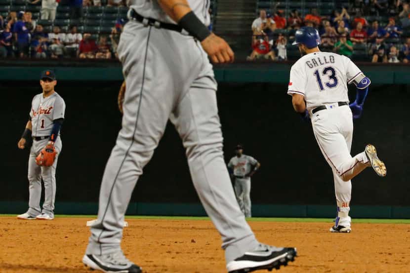 Texas Rangers third baseman Joey Gallo (13) circles the bases after hitting a homer during...