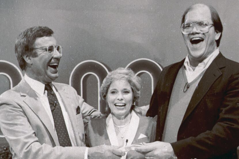 File-This Jan. 16, 1986. file photo shows host Jim Lange, left, congratulating Connie and...