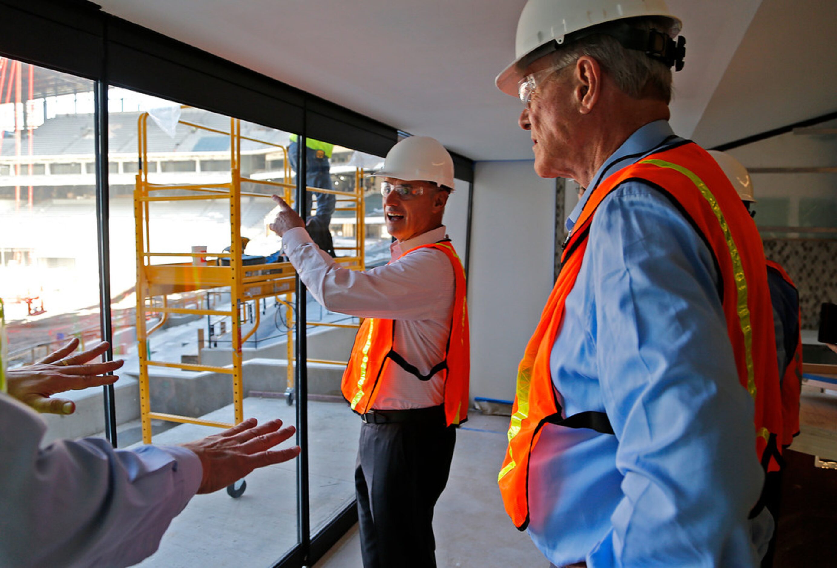 MLB commissioner Rob Manfred (center) talks with Texas Rangers officials as he visited Globe...