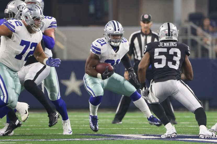 Dallas Cowboys  Ezekiel Elliott (21) runs for yards against Oakland Raiders Jelani Jenkins...