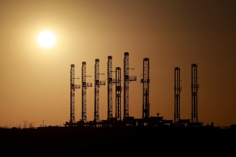 Drilling rigs sit unused in the Permian Basin in mid-March. U.S. oil production remains well...