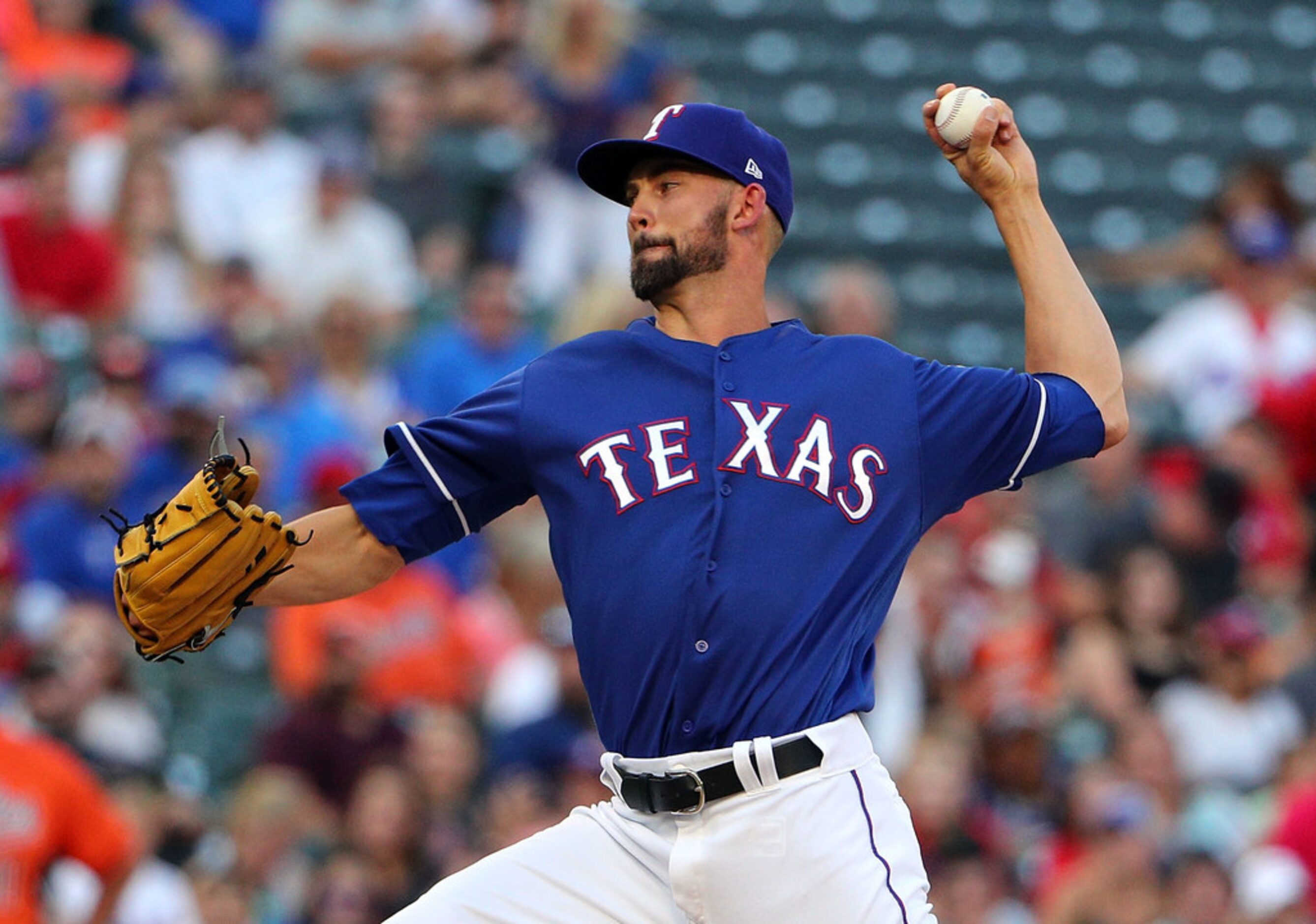 ARLINGTON, TX - AUGUST 04:  Mike Minor #36 of the Texas Rangers throws a pitch against the...