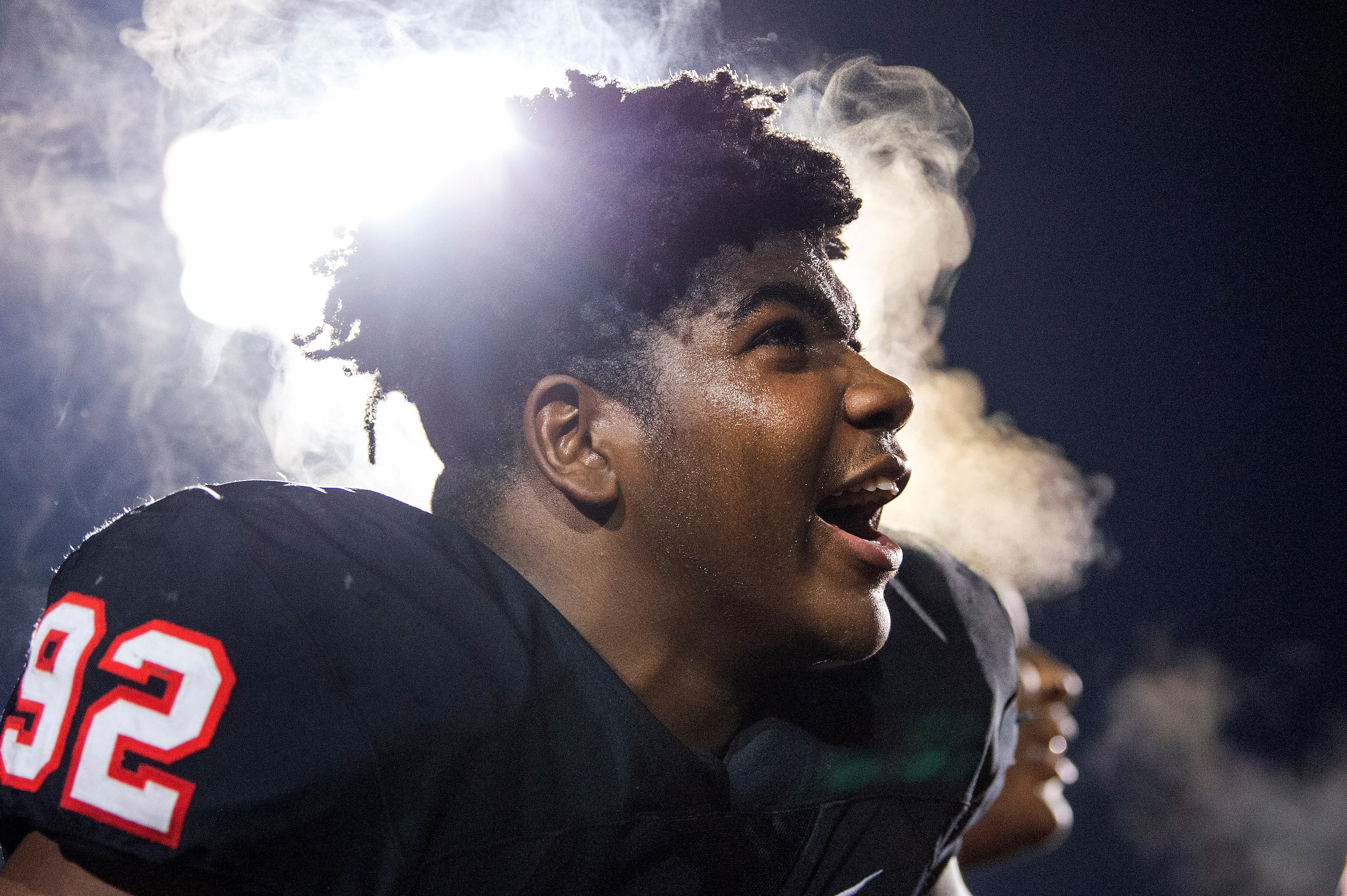 Steam rises from the head of Coppell junior defensive lineman Simi Ncube-Socks (92) as he...