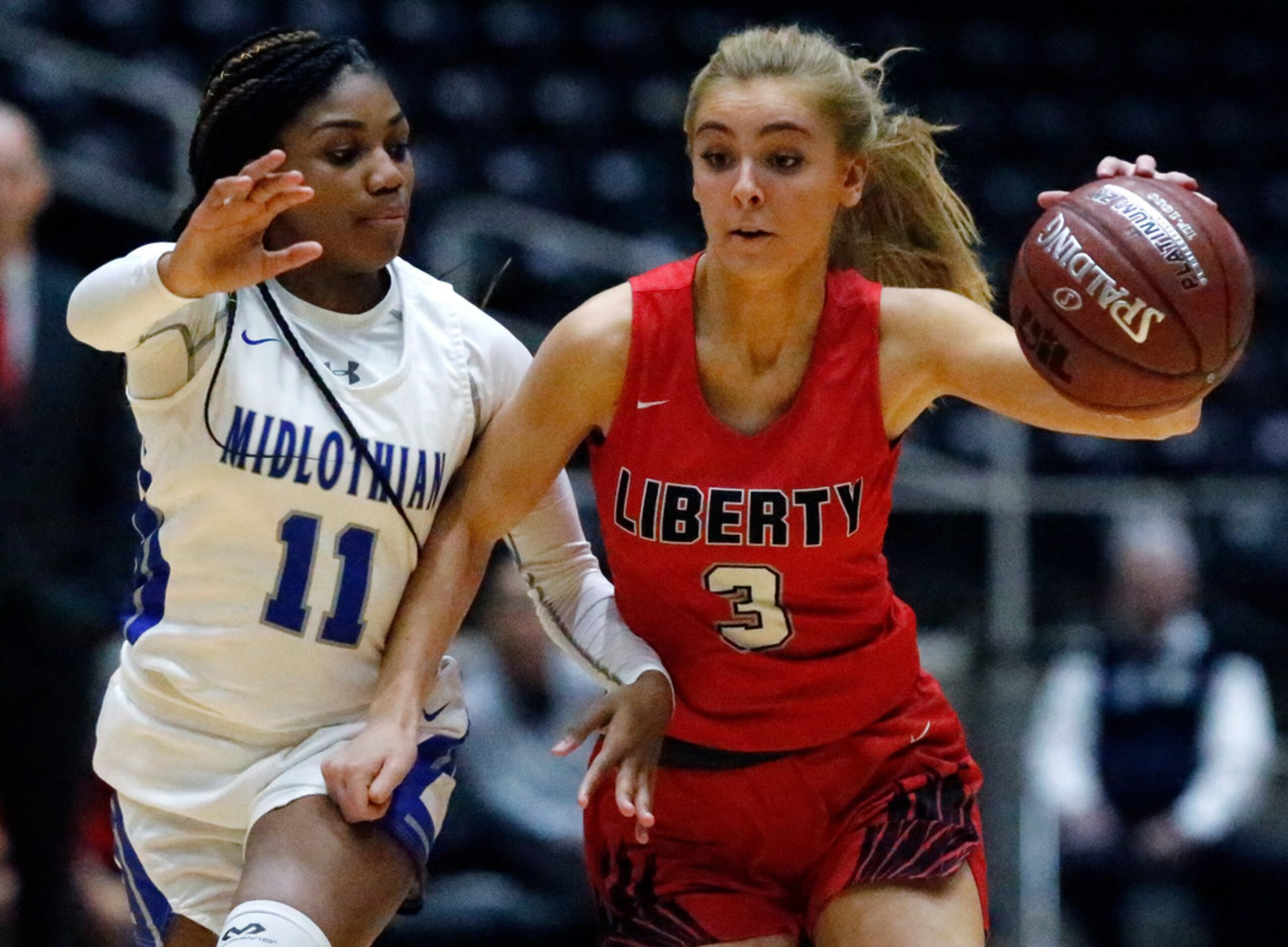 Midlothian High School guard Maykayla Jackson (11) defends Frisco Liberty High School guard...