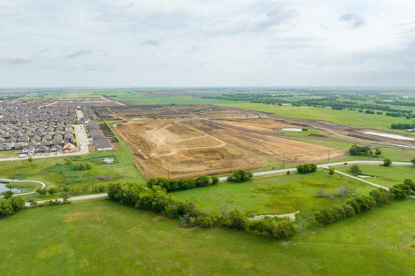 An aerial view of land to be developed into Sutton Fields East, a housing community in...