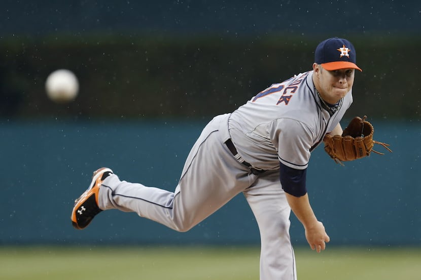 Houston Astros pitcher Brad Peacock throws a warmup pitch against the Detroit Tigers in the...