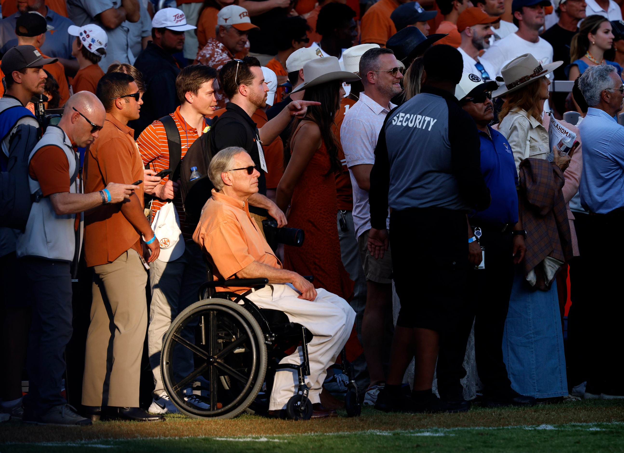 Texas Governor Greg Abbott watches the Texas Longhorns dominate the Oklahoma Sooners in the...