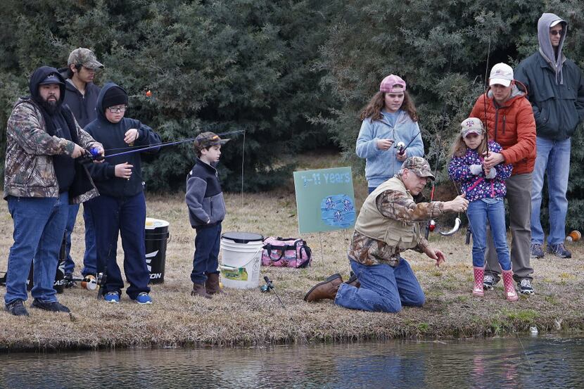 Participants take place in the fishing tournament, the city of Murphy's second annual...