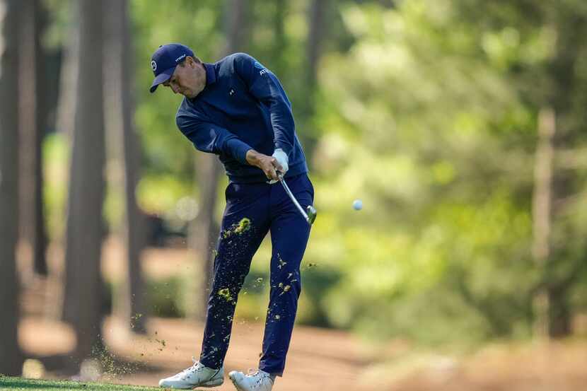 Jordan Spieth hits from the fairway on the 17th hole during the final round of the Masters...