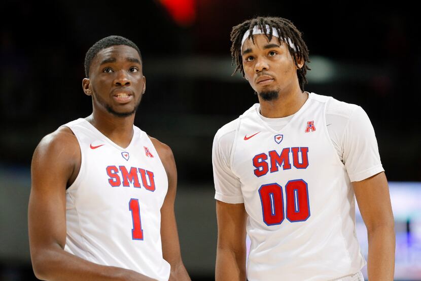SMU's Shake Milton (1) and Ben Moore talk on the court during an NCAA college basketball...