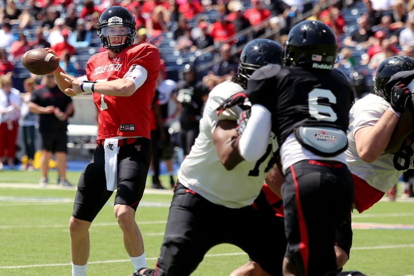 Texas Tech quarterback Davis Webb looks for an open receiver during a spring NCAA college...