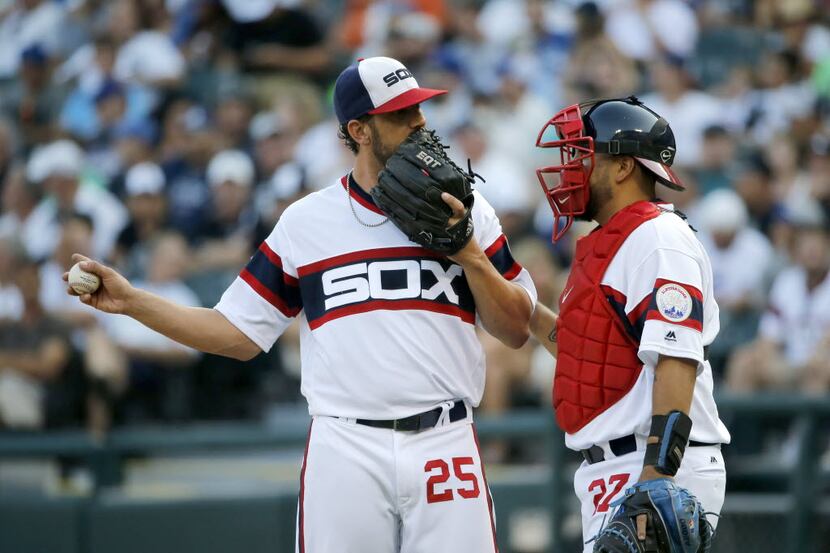 Chicago White Sox starting pitcher James Shields (25) talks with catcher Dioner Navarro...