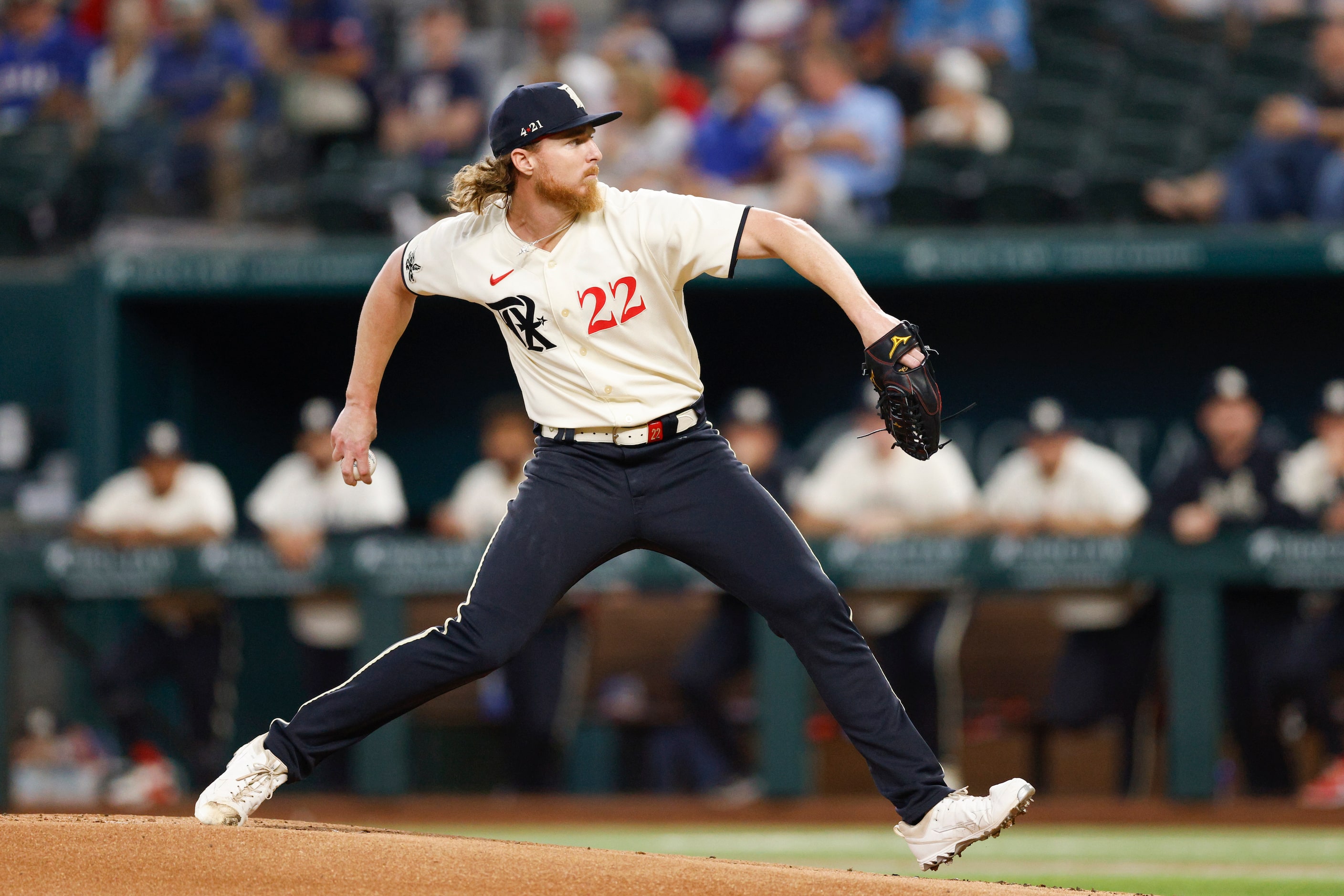 Texas Rangers starting pitcher Jon Gray (22) delivers a pitch during the first inning of a...