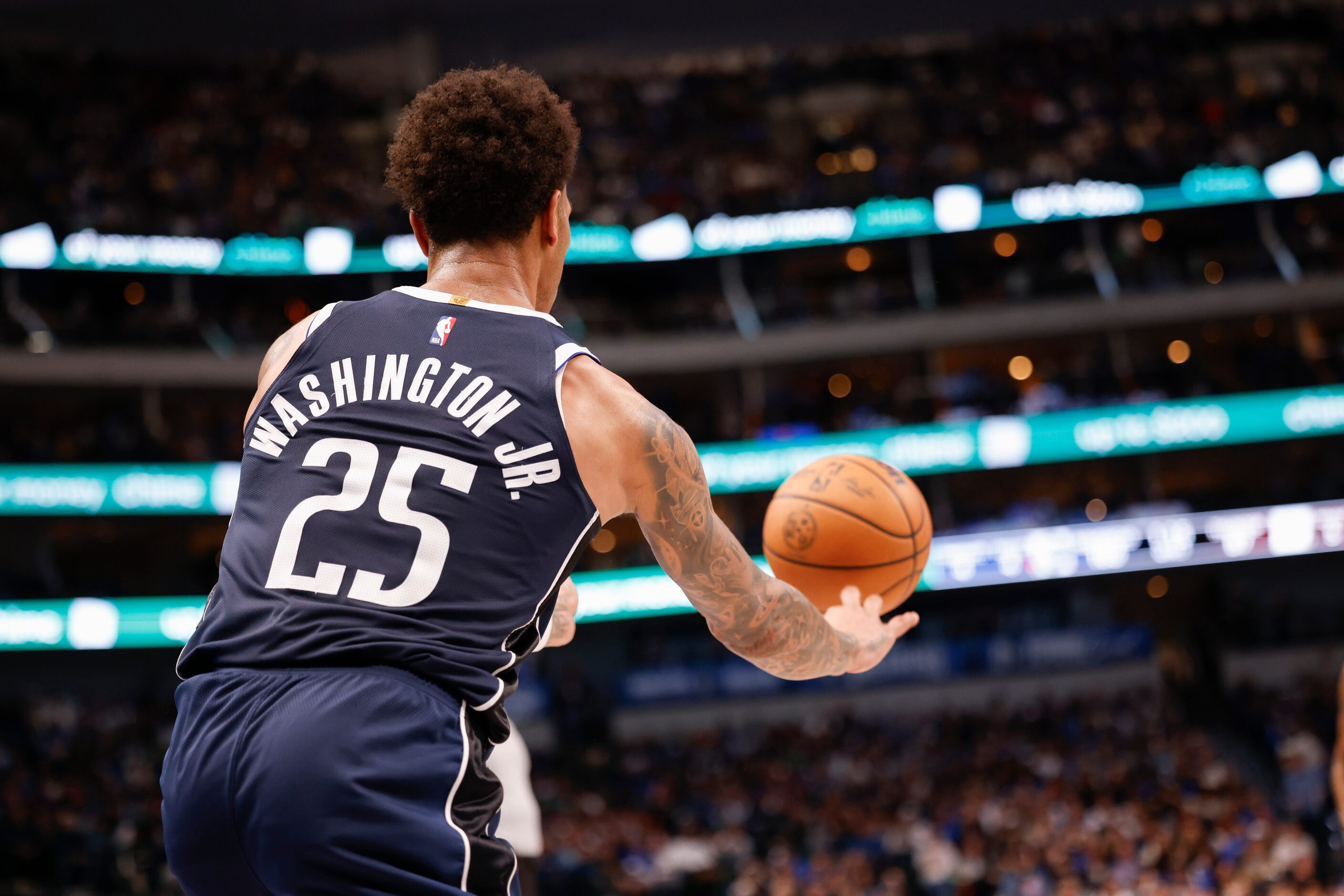 Dallas Mavericks forward P.J. Washington (25) throws the ball during the second half of an...