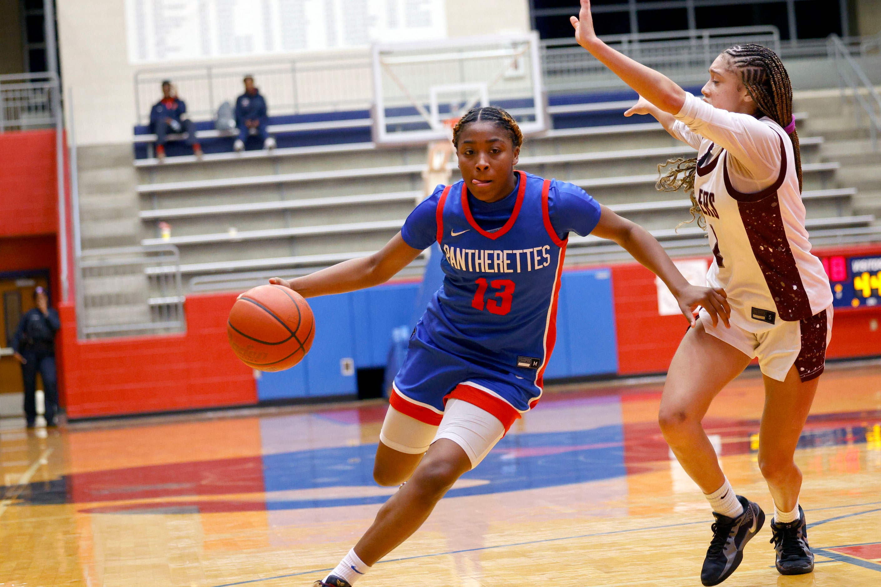 Duncanville's Samari Holmen (13) tries to drive past Pearland's A’Zyua Blair (2) during the...