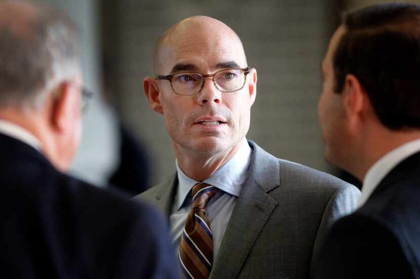 Texas Speaker of the House Honorable Dennis Bonnen (center) visits with colleagues during...