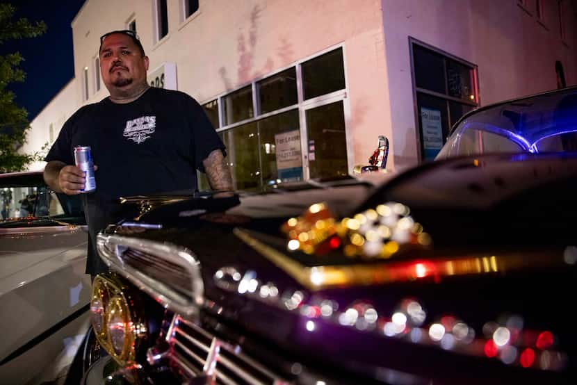 Mark Mata with Dallas Lowriders stands next to his 1959 Chevrolet Impala on Sunday, Sept....