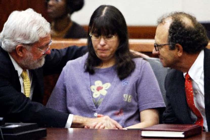 Andrea Yates, flanked by her lawyers George Parnham (left) and Wendell Odom, looks on after...