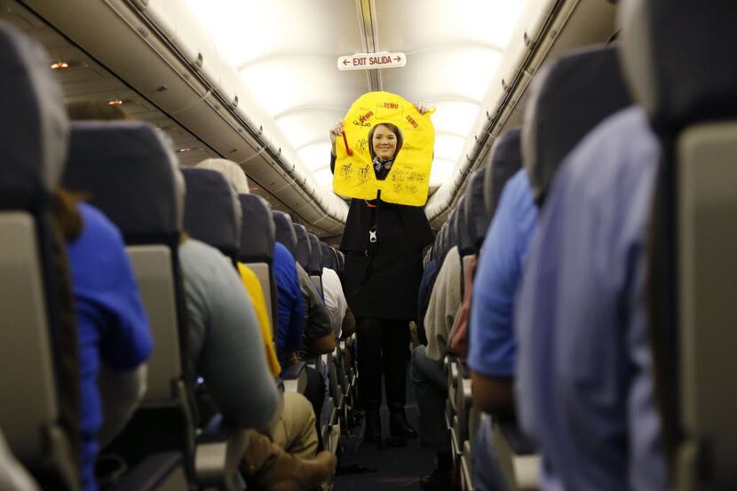 Southwest Airlines flight attendant Stuart Fisher goes over the safety issues on a Southwest...