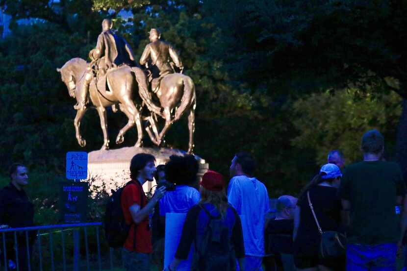 Protesters gather at Robert E. Lee Park in Dallas, Sunday, September 10, 2017 anticipating...
