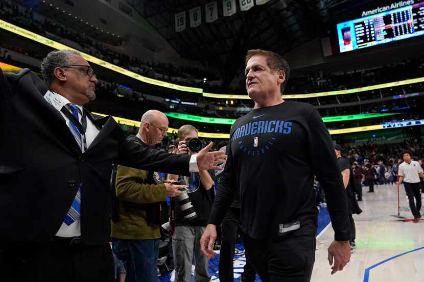 Dallas Mavericks team owner Mark Cuban walks off the court after an NBA basketball game...