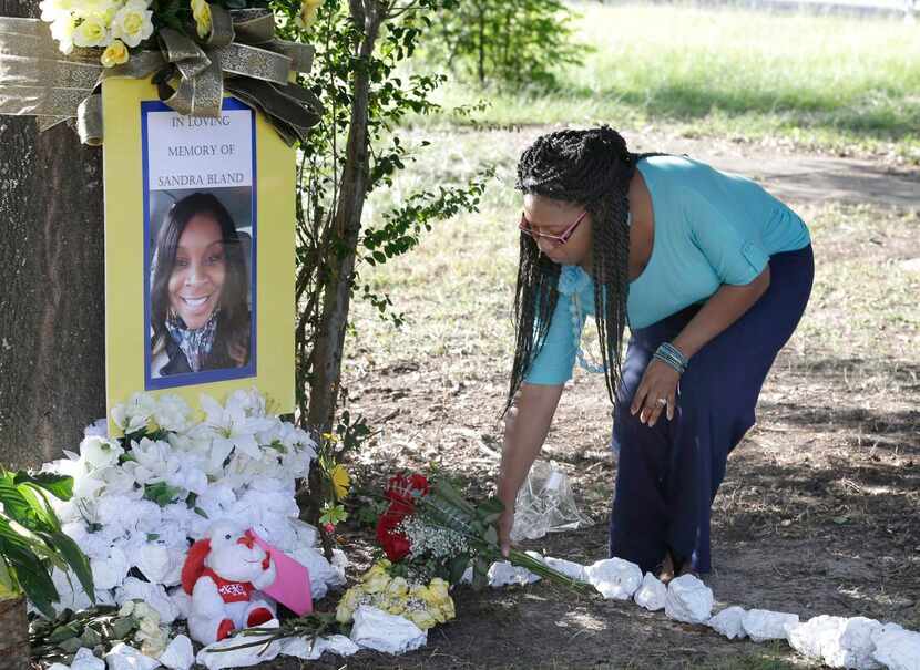 
Jeanette Williams placed roses at a memorial for Bland on the Prairie View A&M campus,...