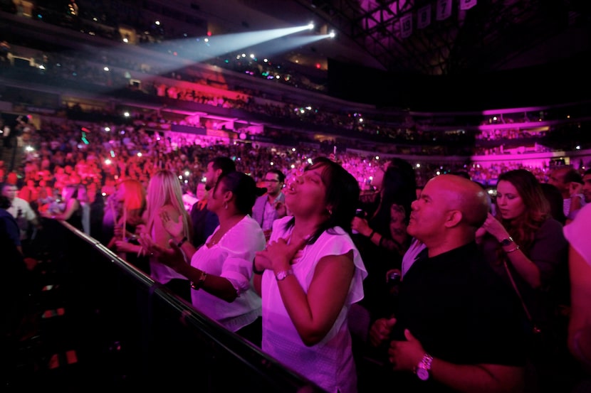 Fans sing along as Marc Anthony performs.