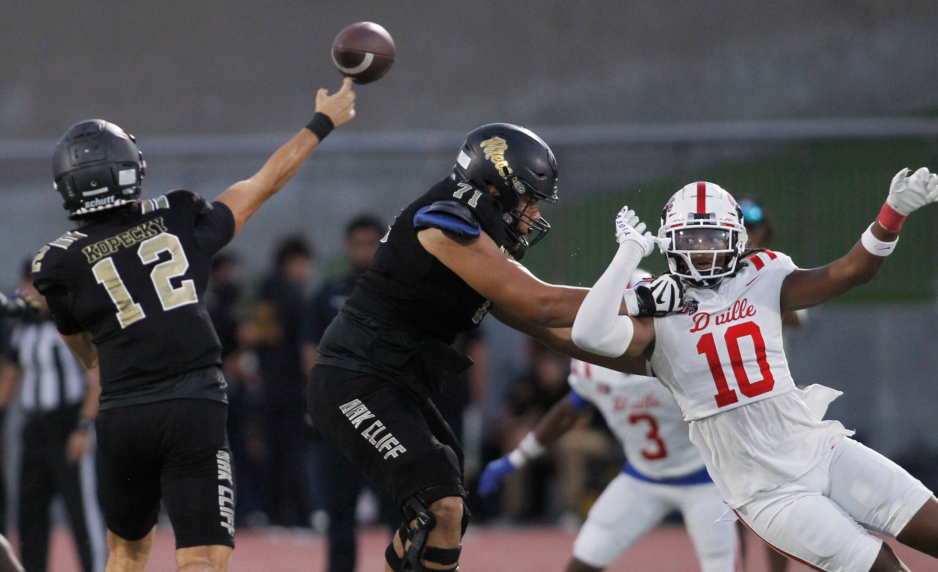 South Oak Cliff quarterback Carter Kopecky (12), left, launches a pass downfield as...