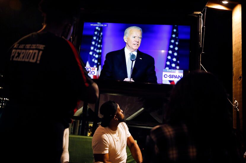 Patrons at a McKinney Avenue restaurant-bar watched as President-elect Joe Biden delivered...