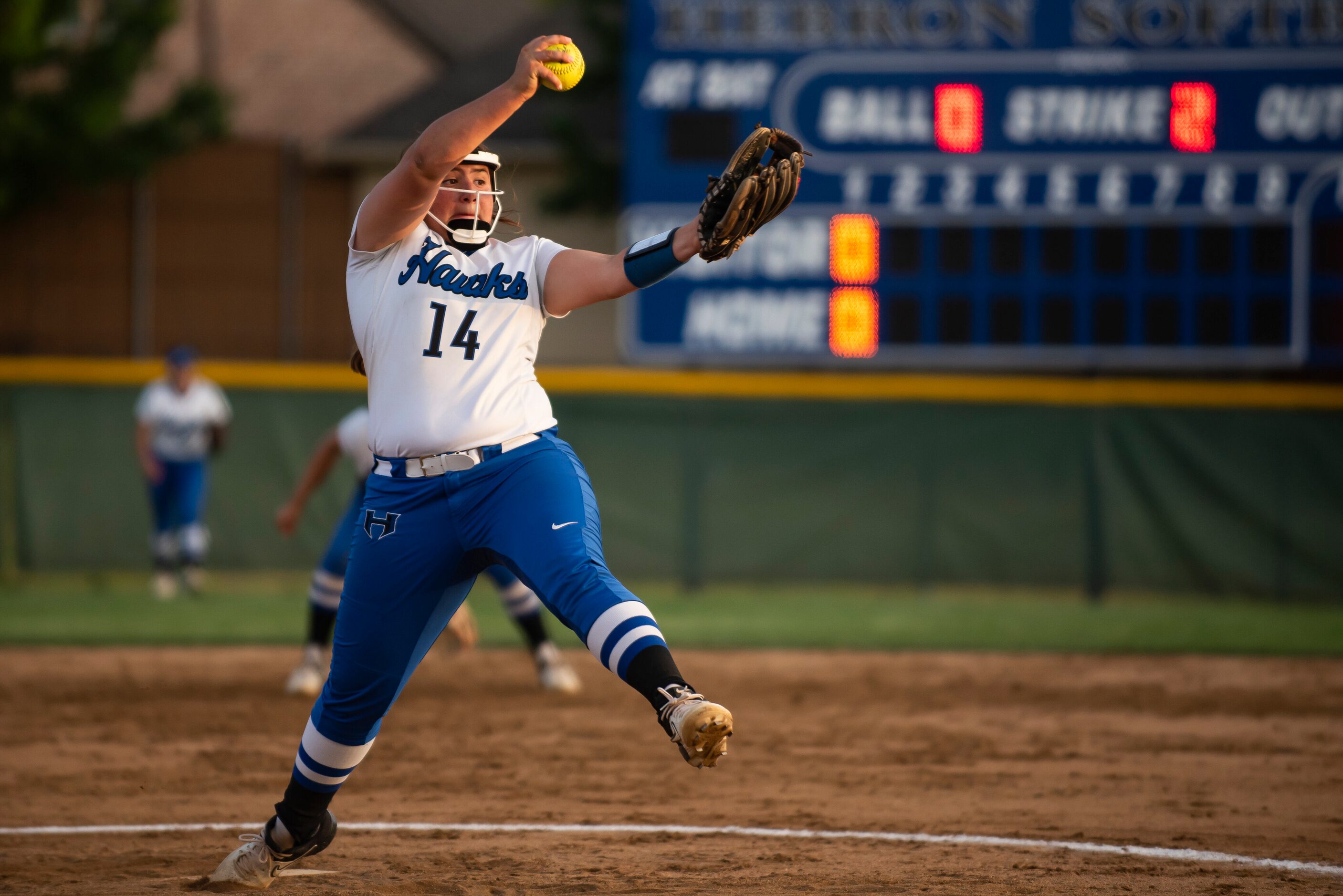 Hebron pitcher Lucy Crowder (14) delivers a pitch during the District 6-6A title game...