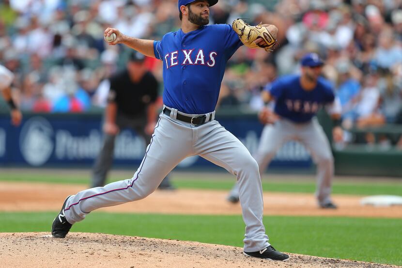 Jun 20, 2015; Chicago, IL, USA; Texas Rangers starting pitcher Nick Martinez (22) delivers a...