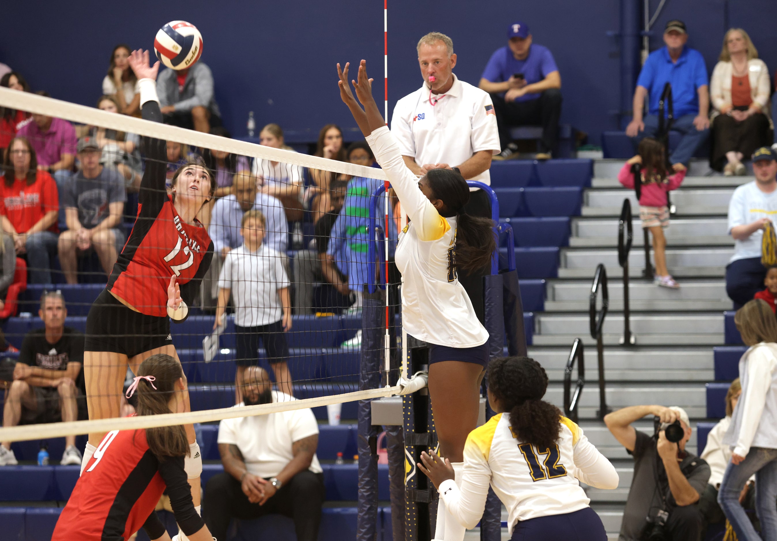 Ursuline player #12 Sophia Thornburg returns for the ball during the Ursuline Academy of...