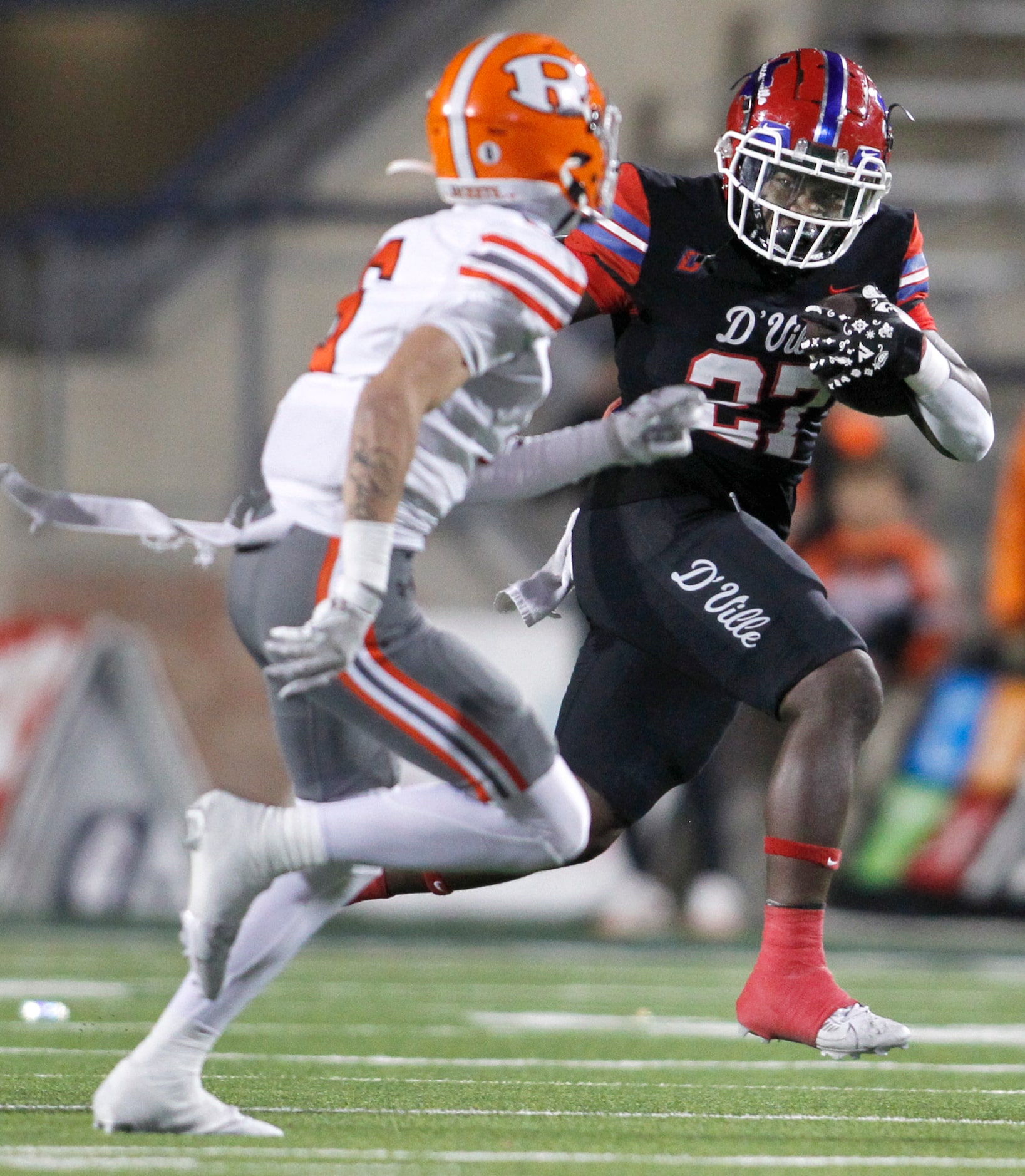 Duncanville running back JaQualon Armstrong (27), right, sprints for a first down as he is...