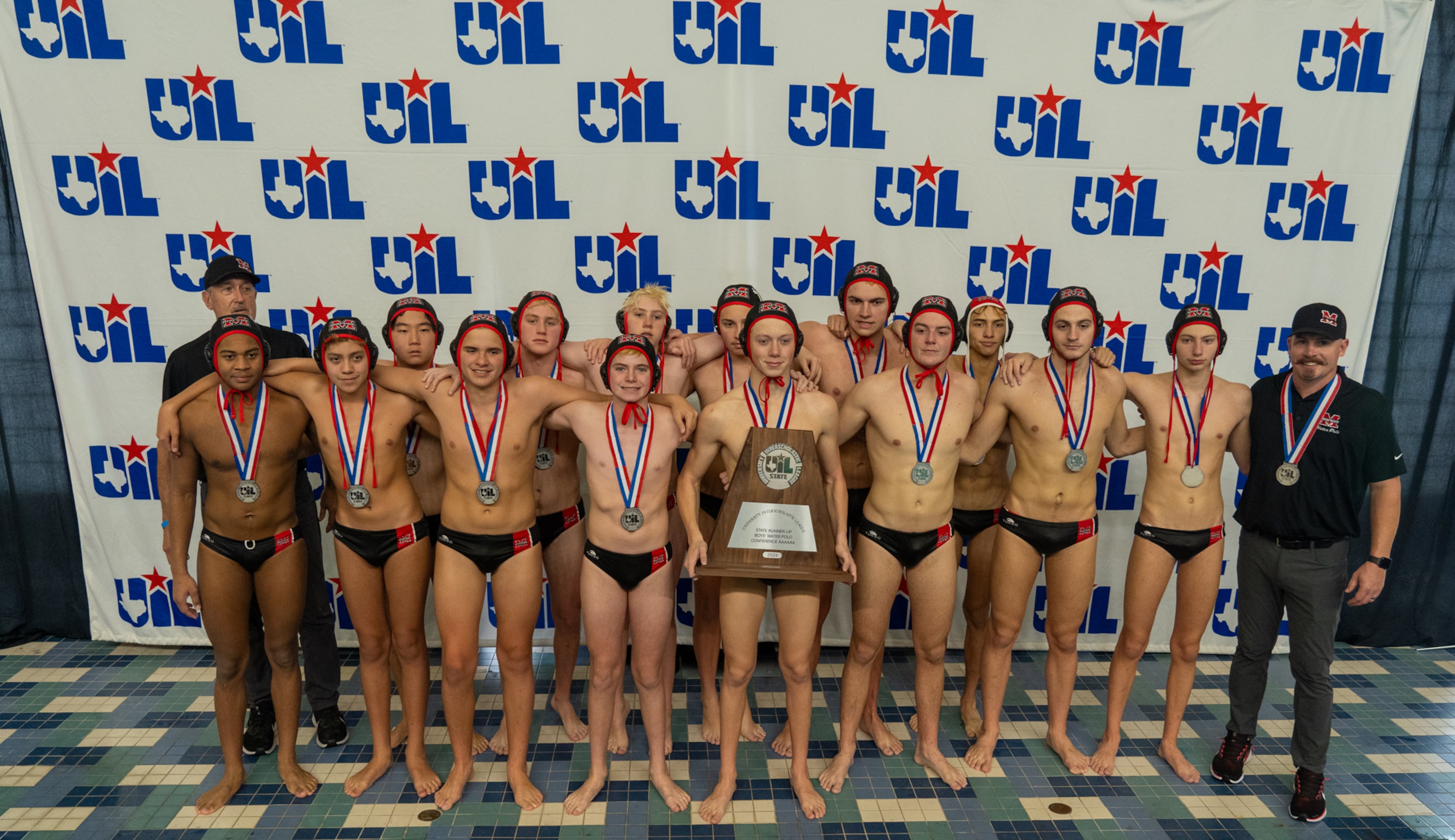 The Flower Mound Marcus Marauders pose with their runner-up trophy after losing to the Clear...