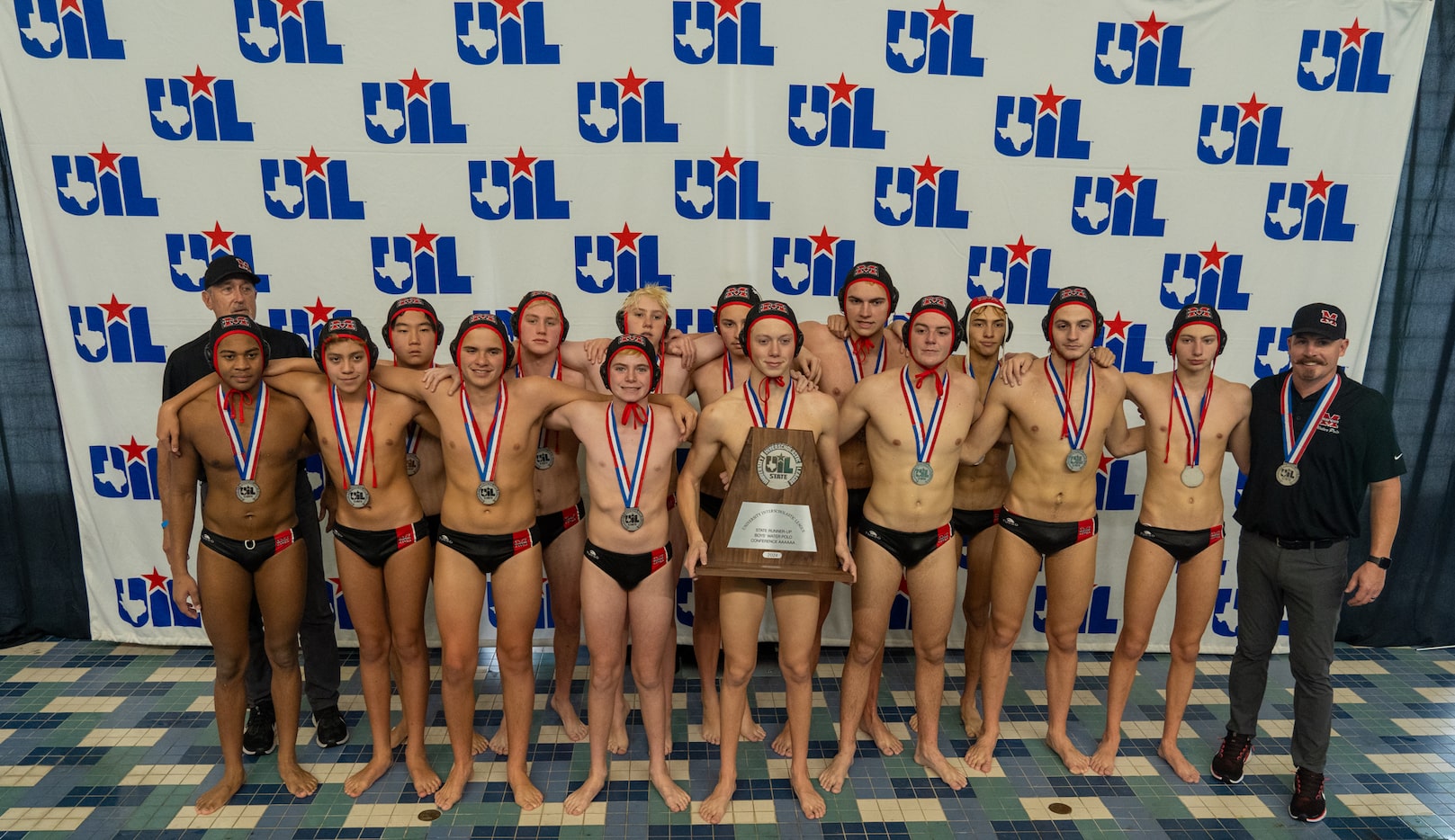 The Flower Mound Marcus Marauders pose with their runner-up trophy after losing to the Clear...