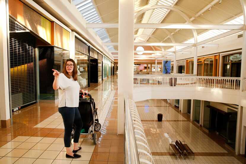 Pushing her two young sons in a stroller in an empty Collin Creek Mall, Plano resident Molly...